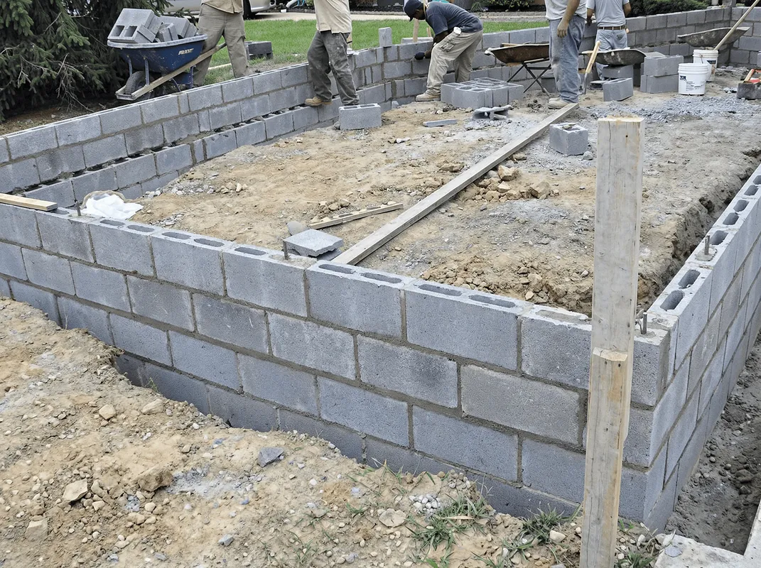 Professionals building a foundation with blocks in Glendale, AZ