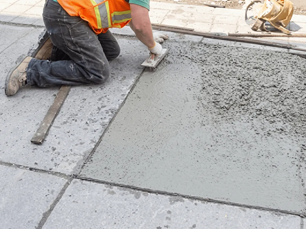 Professional repairing a concrete floor in Glendale, AZ
